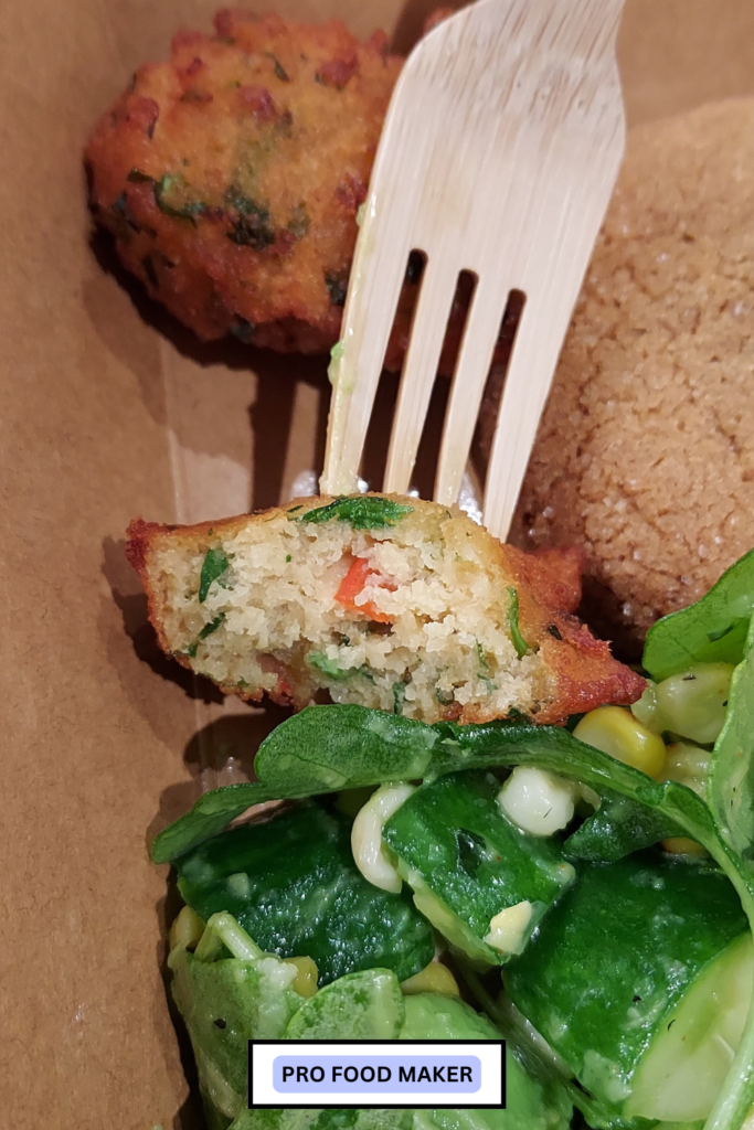 Lentil nuggets. You can see the inside next to the grilled corn salad.