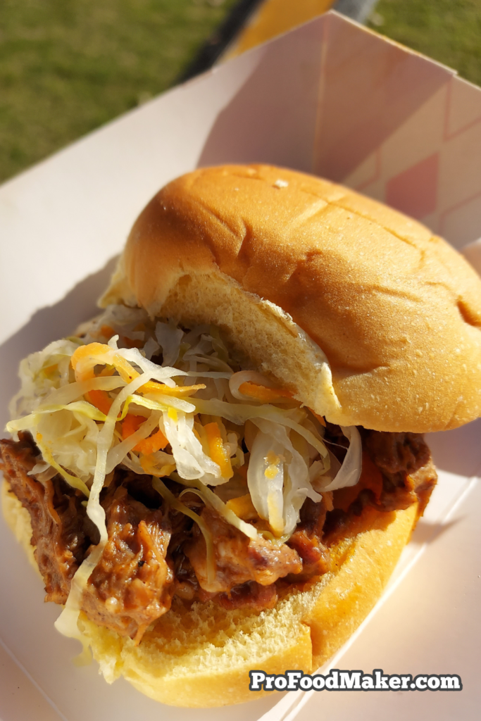 Pulled Berbere spiced lamb with harissa & pikliz slider from Erick Williams of Virtue at Southern Smoke Festival 2023