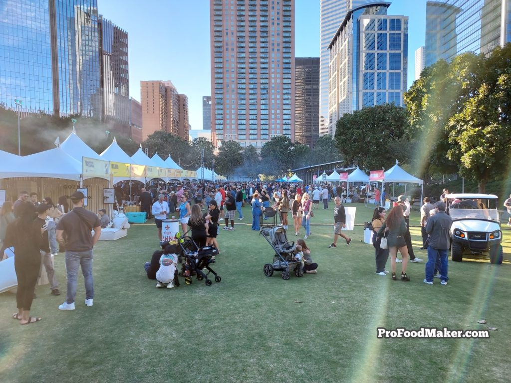 Southern Smoke Festival. Hundreds of people in attendance. Golf cart on the right.