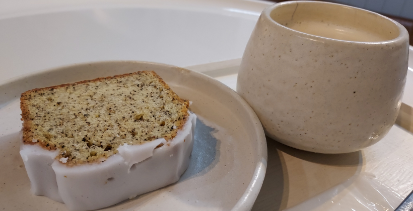 baggage coffee tokyo. A slice of pound cake and a small mug of chai latte.