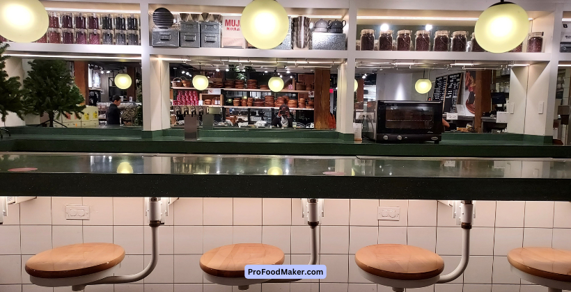 bar seating at one of the shops in chelsea food market nyc