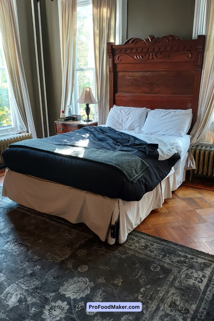 Regal Retreat guest room with queen size bed and nightstand