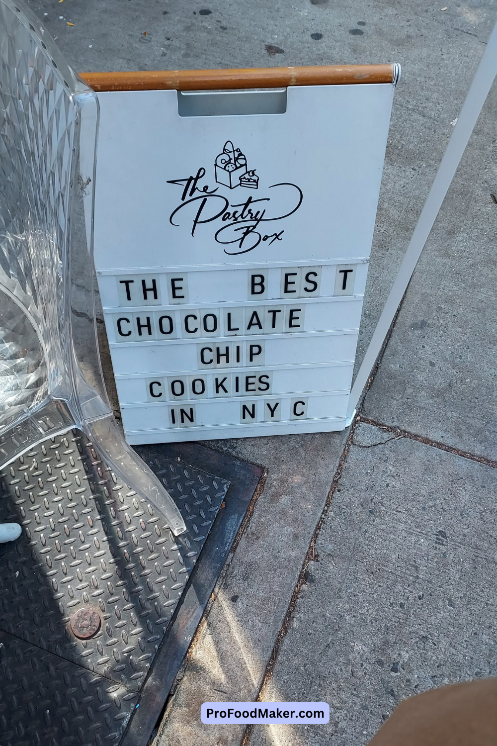 The Pastry Box white sign that says, 'The Best Chocolate Chip Cookies in NYC'