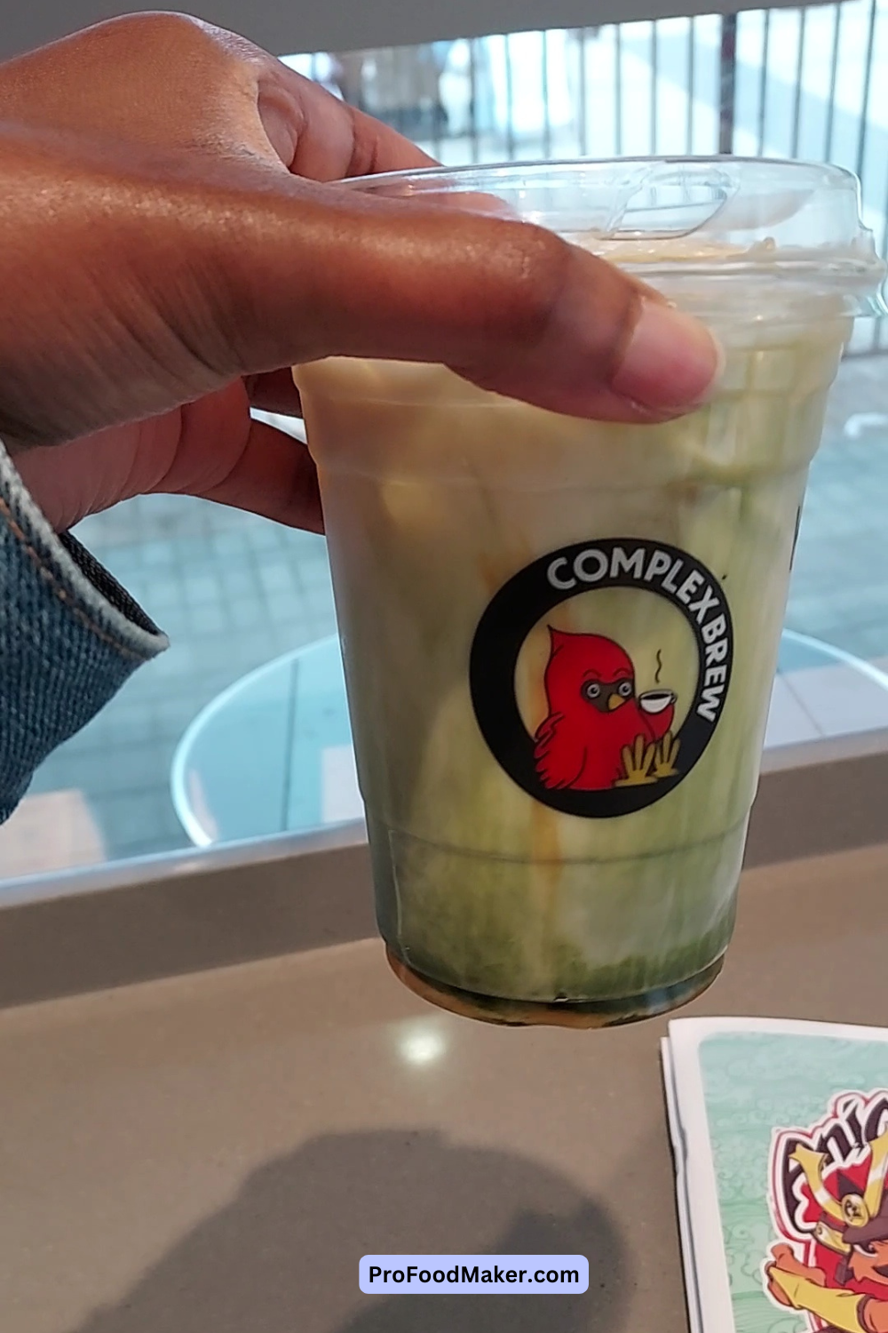 iced caramel matcha next to animazement schedule