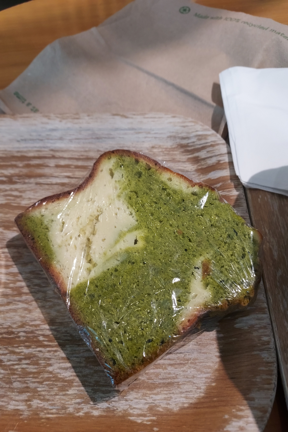 matcha poundcake with cream cheese on a wooden tray